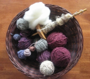 Wool fiber, drop spindle, handspun yarn:  the tools for world peace